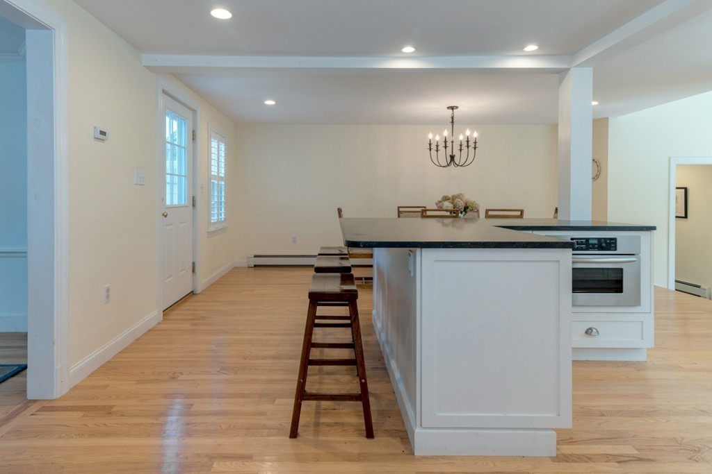 76 Clifton Road Milton, MA 02186 - Photo 9 of 28 a kitchen with stainless steel appliances a sink and a stove