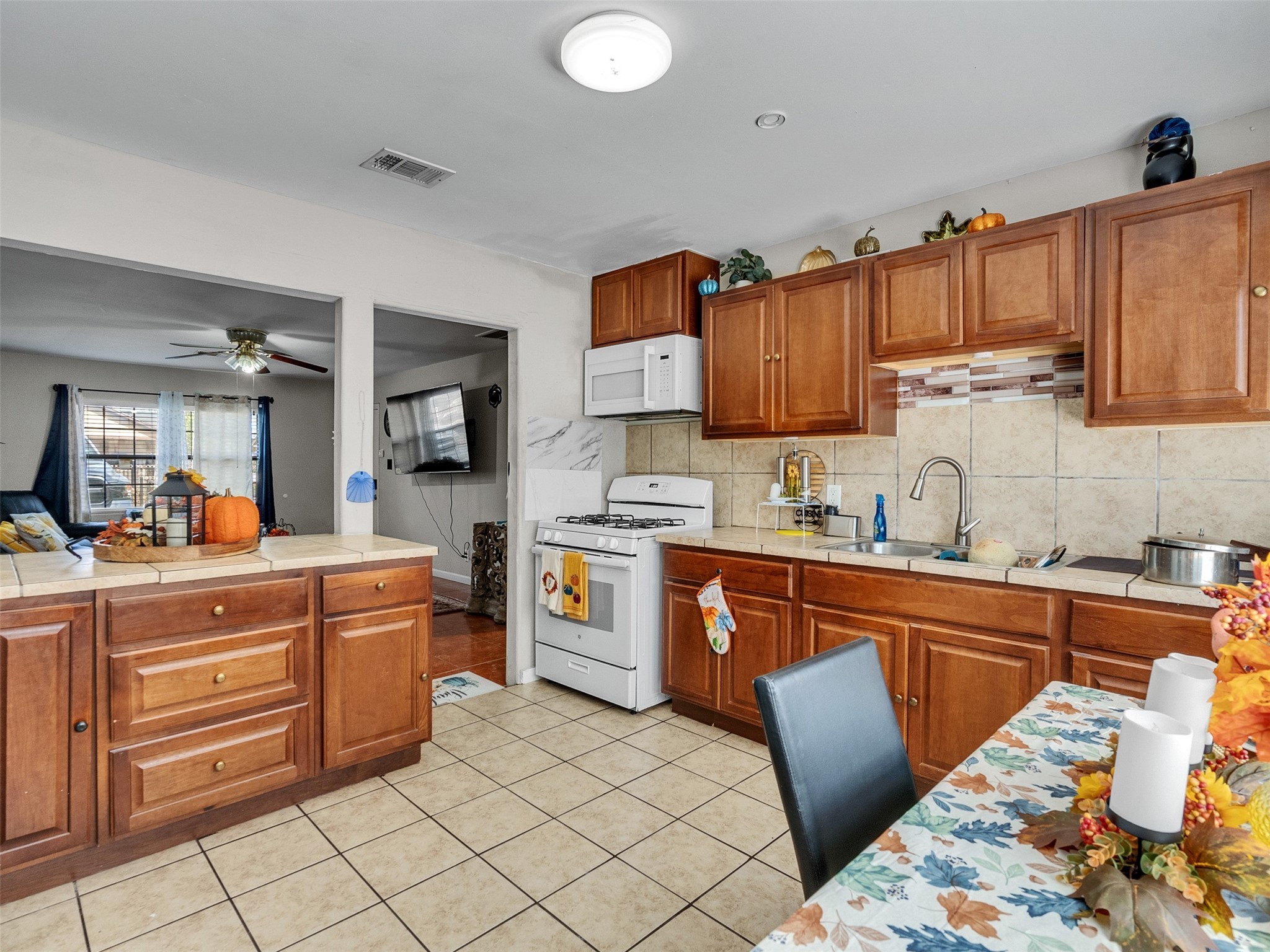 6802 Force Street Houston, TX 77020 - Photo 12 of 31 a kitchen with stainless steel appliances granite countertop a sink and cabinets