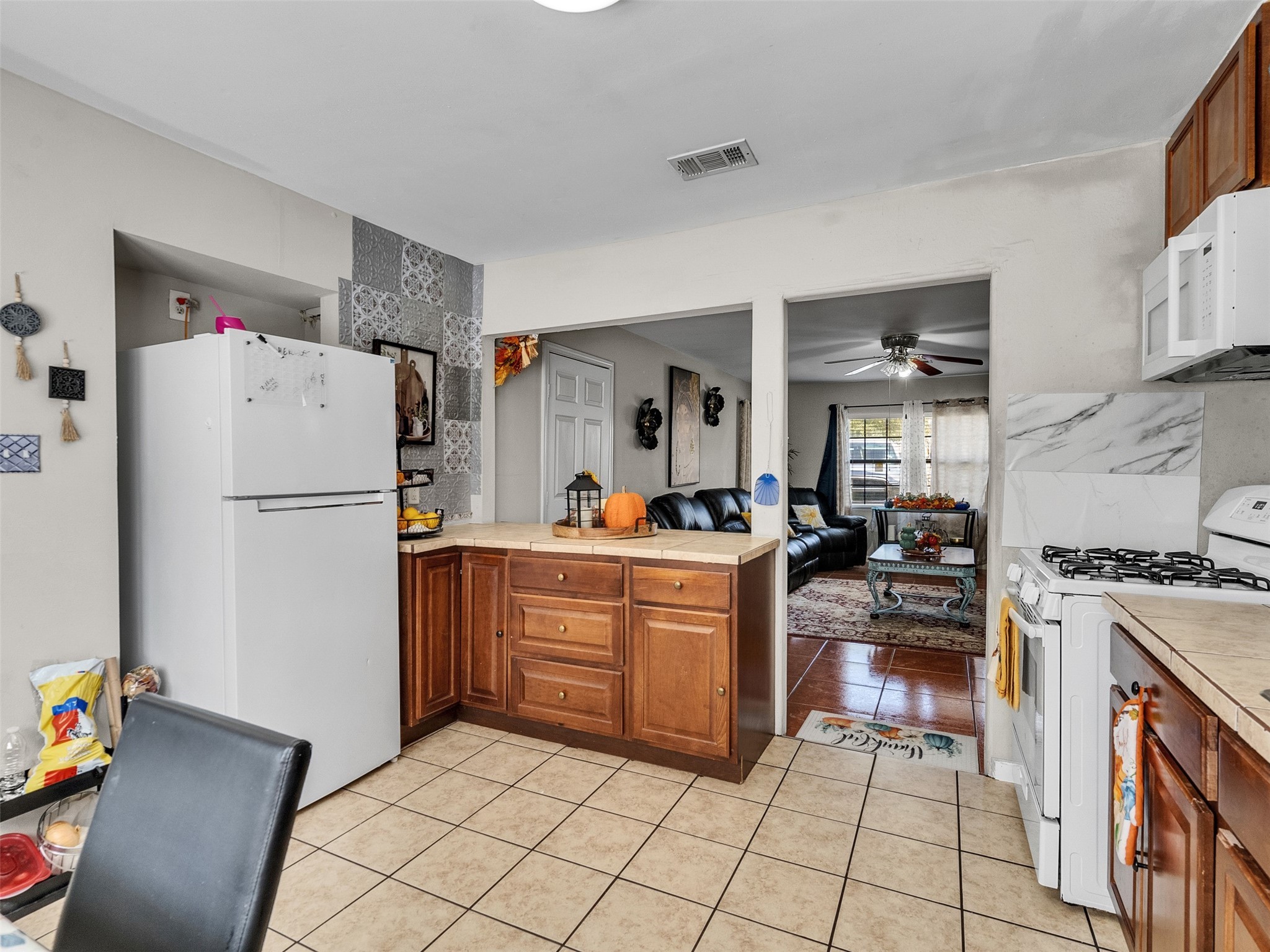 6802 Force Street Houston, TX 77020 - Photo 13 of 31 a kitchen with granite countertop cabinets and appliances