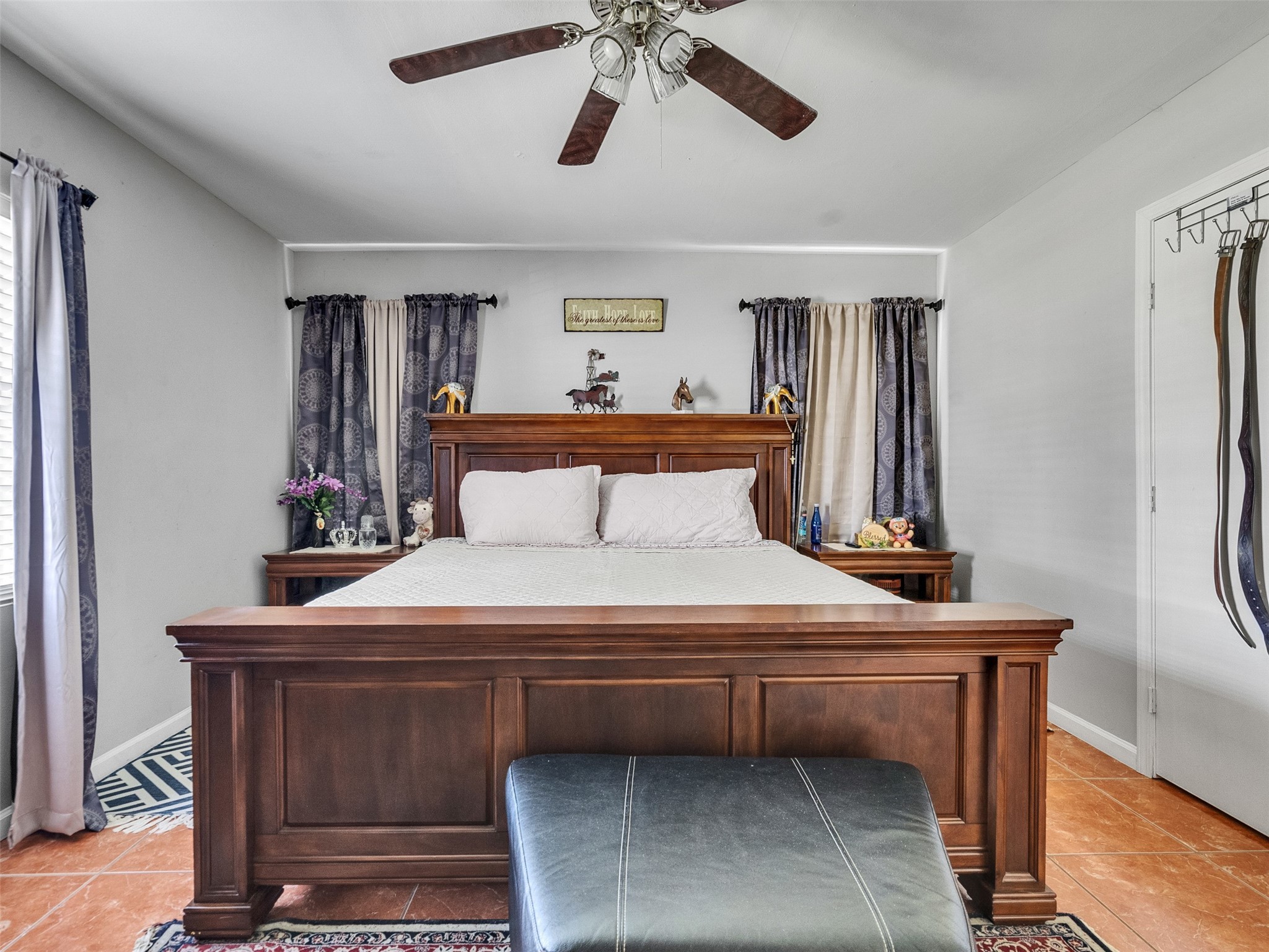 6802 Force Street Houston, TX 77020 - Photo 18 of 31 a bedroom with a bed and a chandelier