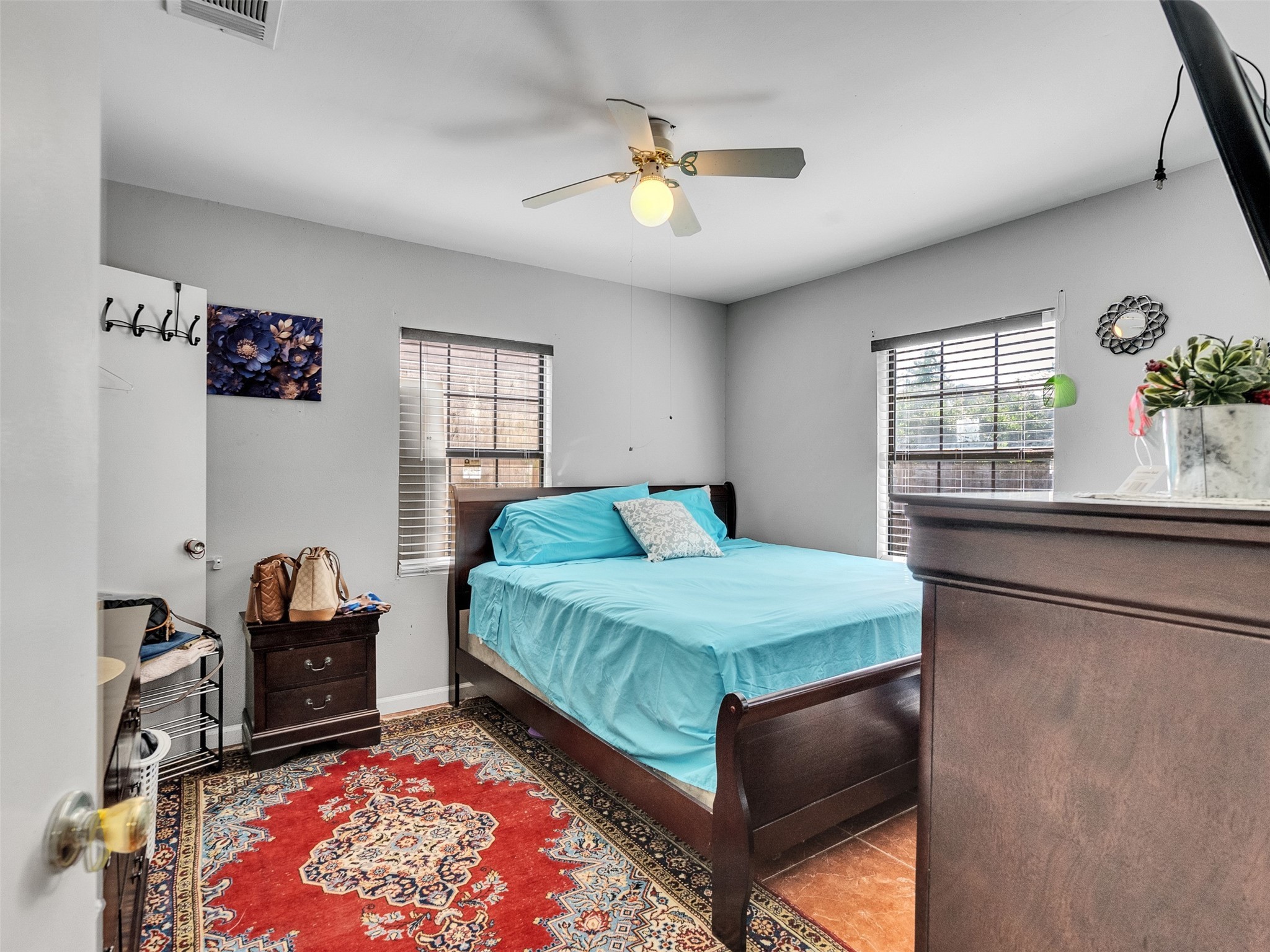 6802 Force Street Houston, TX 77020 - Photo 21 of 31 a bedroom with a bed and a window