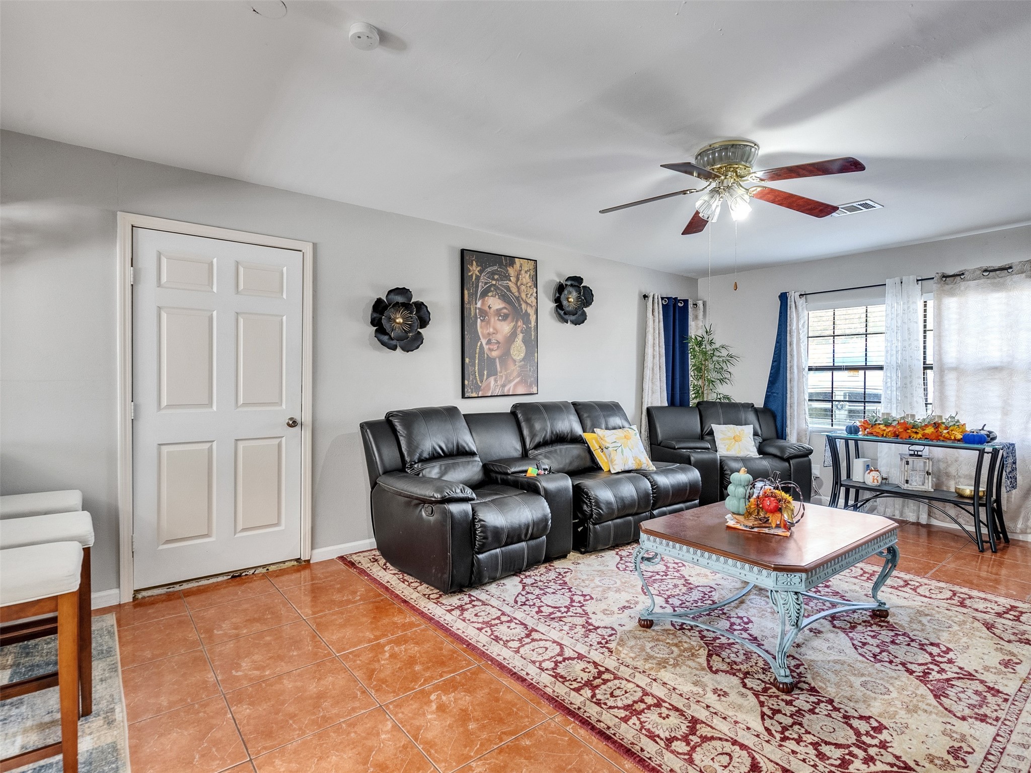 6802 Force Street Houston, TX 77020 - Photo 9 of 31 a living room with furniture a rug and a window