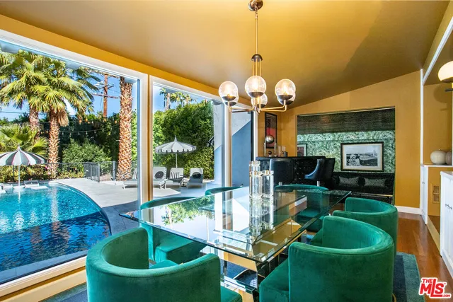 a view of a room with furniture and a window