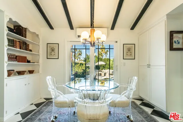 a kitchen with a checkered floor and white cabinets