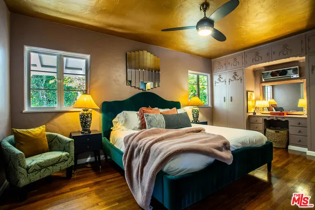 a bedroom with a bed and lamp with the outer view