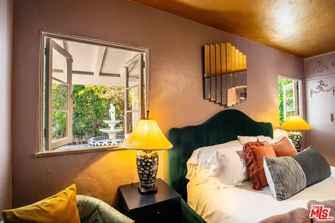 a bathroom with a sink mirror and vanity