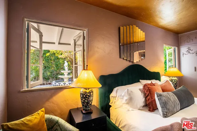 a bathroom with a sink mirror and vanity