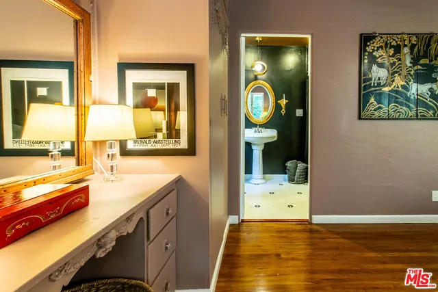 a view of a house with swimming pool and furniture