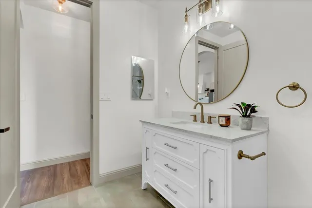 a bathroom with a sink and a mirror