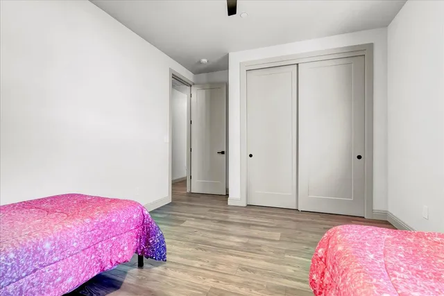 a bed room with a bed and a window