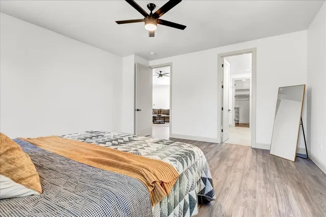 a bedroom with a bed and a table in it