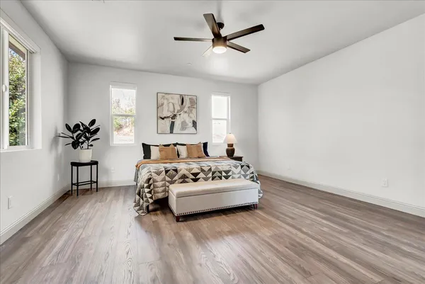 a bedroom with a bed and a window