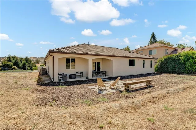 a front view of a house with yard