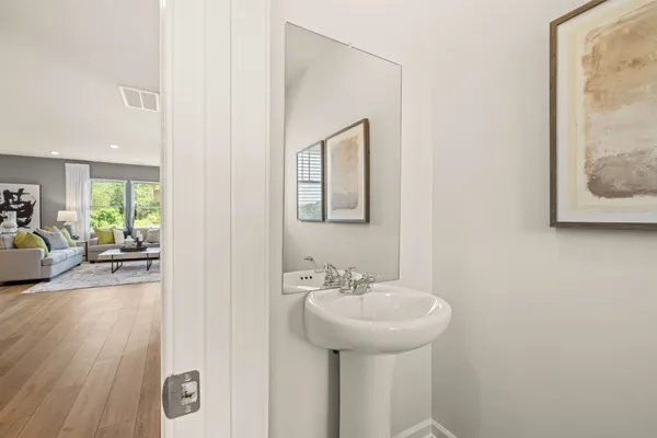 a view of kitchen dining table chairs microwave and cabinets