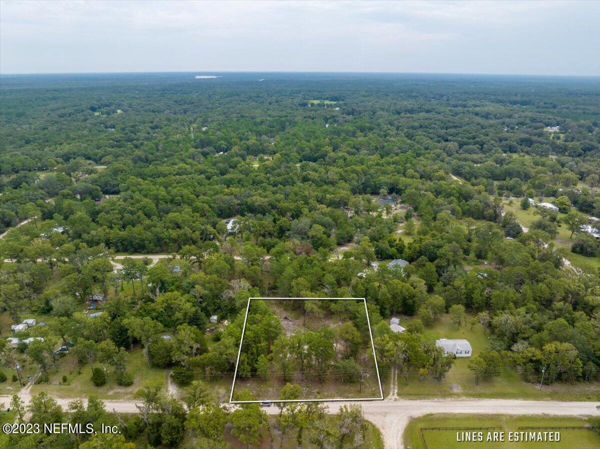 208 4th Street Satsuma, FL 32189 - Photo 4 of 15 an aerial view of residential houses with outdoor space and trees