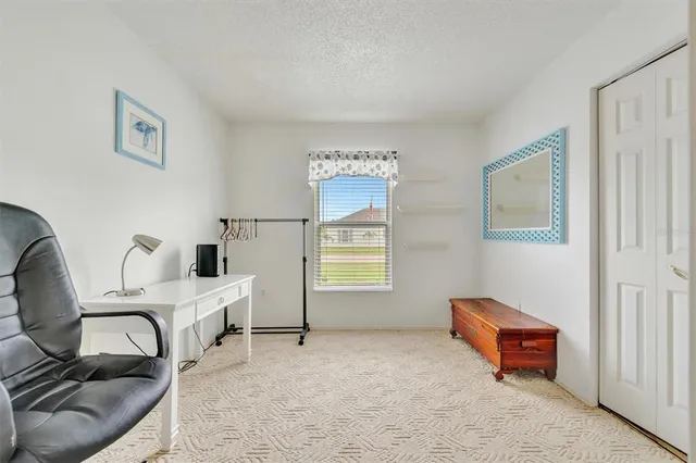 a workspace with furniture and window