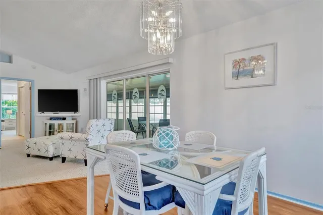 a view of a livingroom with furniture and a flat screen tv