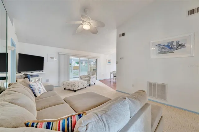 a bedroom with a bed furniture and a flat screen tv