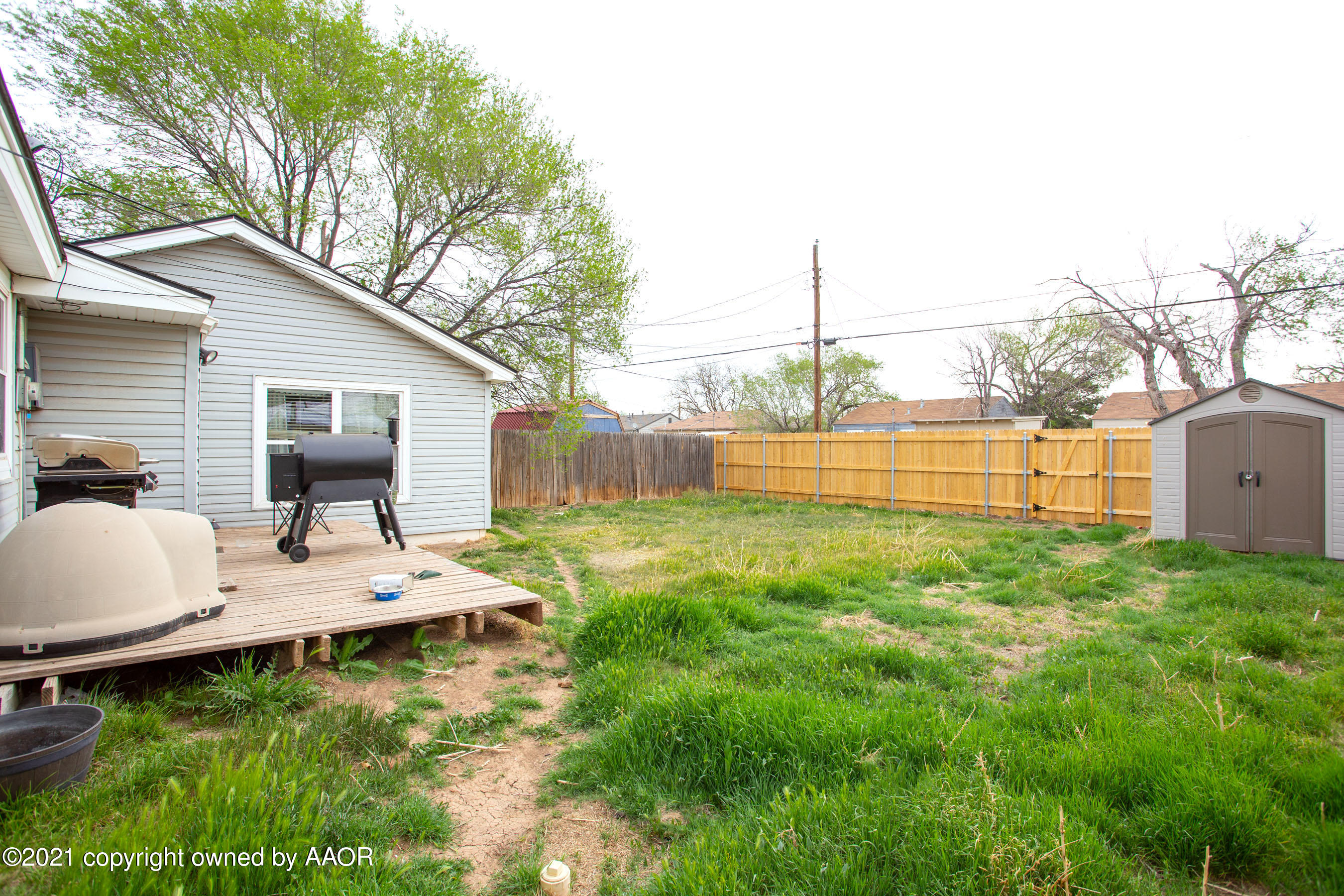 4209 South Jackson Street Amarillo, TX 79110 - Photo 17 of 18 a view of a house with backyard and sitting area