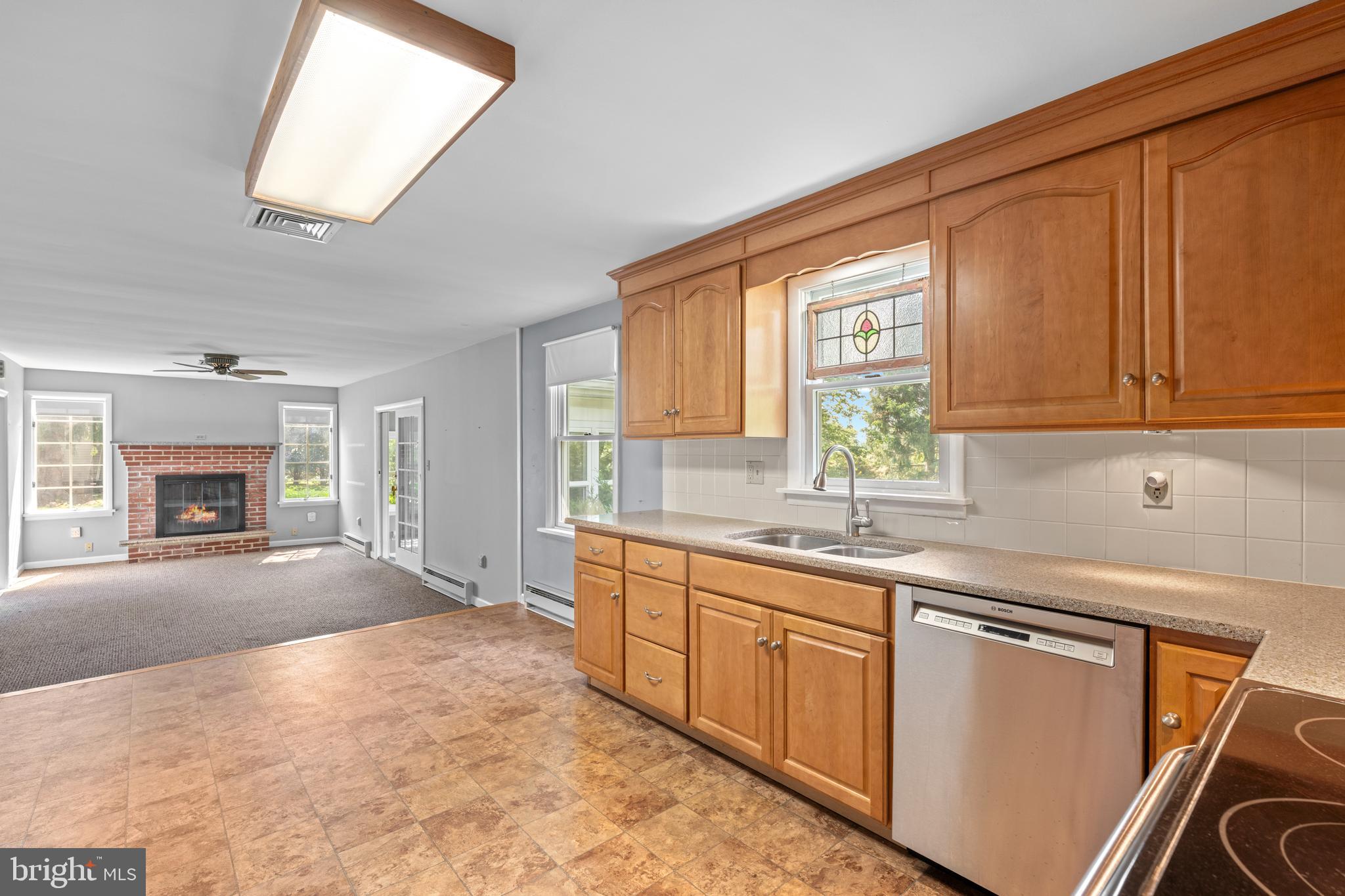 258 Monacy Road Coatesville, PA 19320 - Photo 18 of 54 a kitchen with granite countertop a sink stove and cabinets