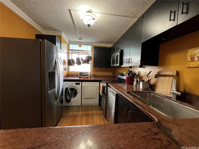 a kitchen with a refrigerator and a sink