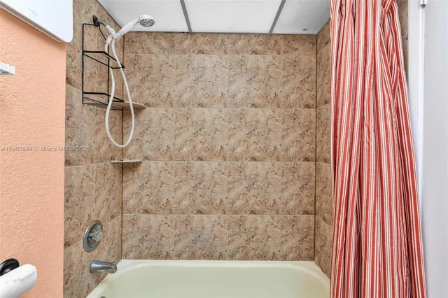 a bathroom with a shower curtain