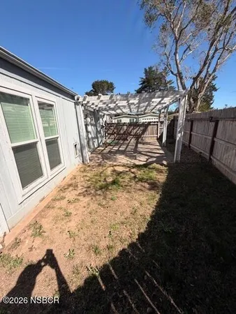 a view of a backyard of the house