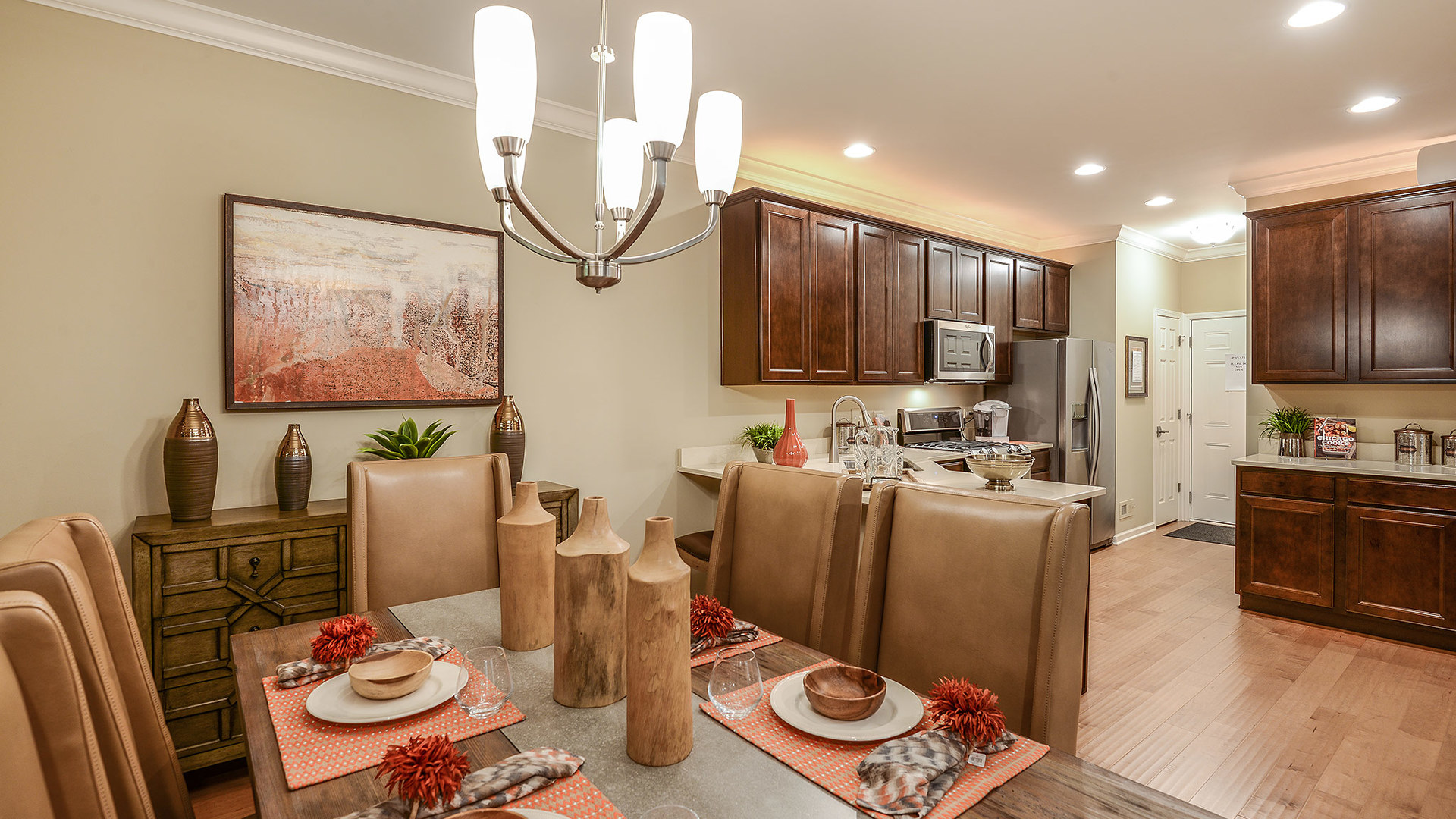 2025 Stuttle Road Batavia, IL 60510 - Photo 5 of 22 a living room with furniture a flat screen tv and kitchen view