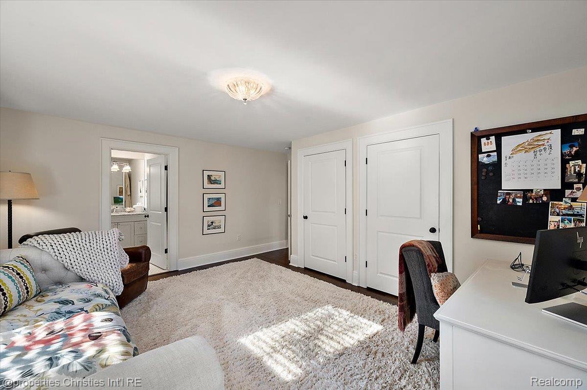 528 Covington Road Bloomfield Hills, MI 48301 - Photo 43 of 75 Interior room featuring dark wood-finish flooring, light-colored walls, and a contemporary ceiling light fixture