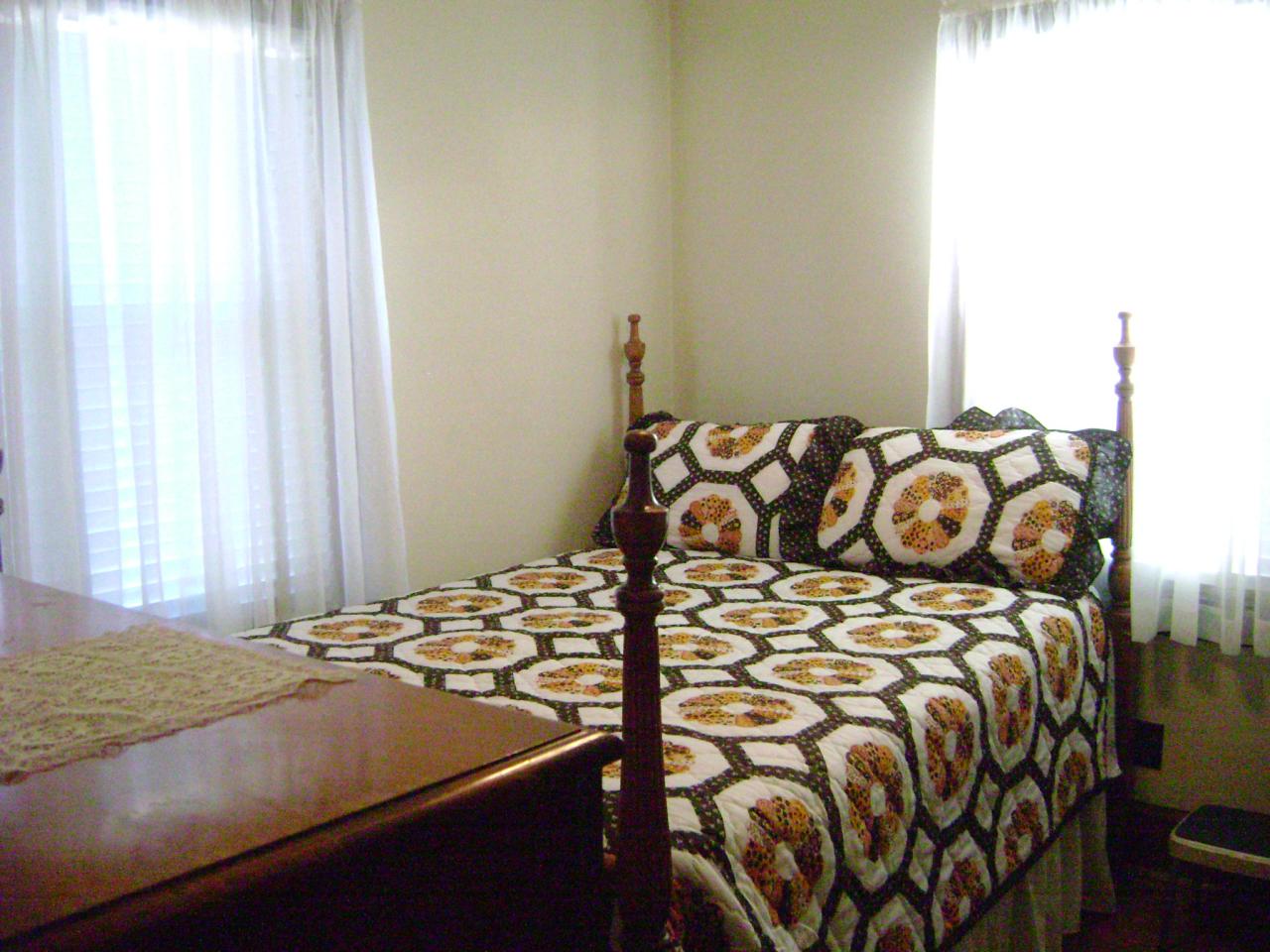 2803 Highland Road Roanoke, VA 24014 - Photo 7 of 10 a bed sitting in a bedroom next to a window