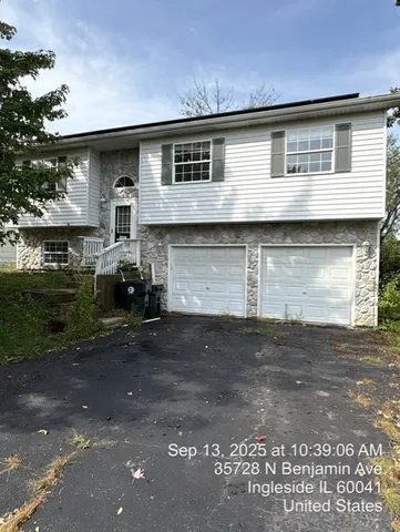a front view of a house with garage