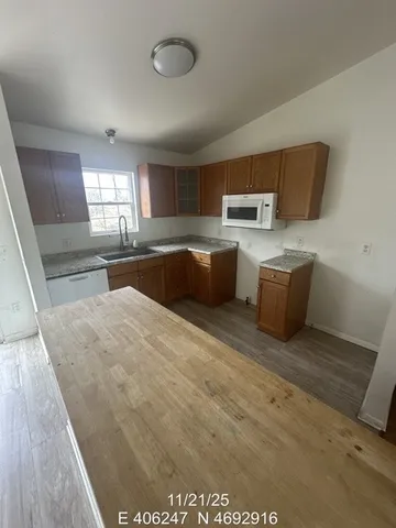 a kitchen with sink cabinets and window