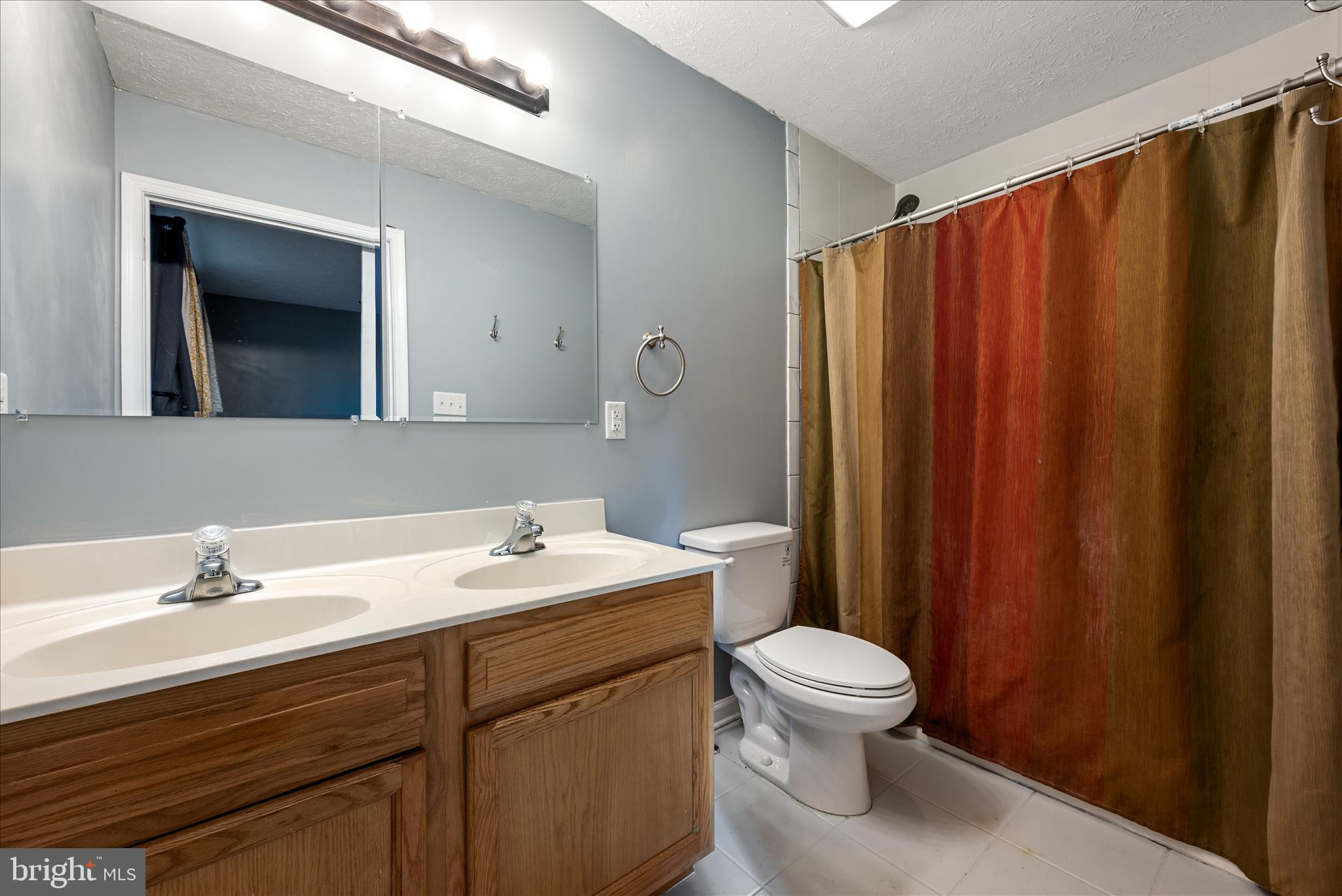 181 Brook View Road Front Royal, VA 22630 - Photo 14 of 47 a bathroom with a sink a toilet and mirror