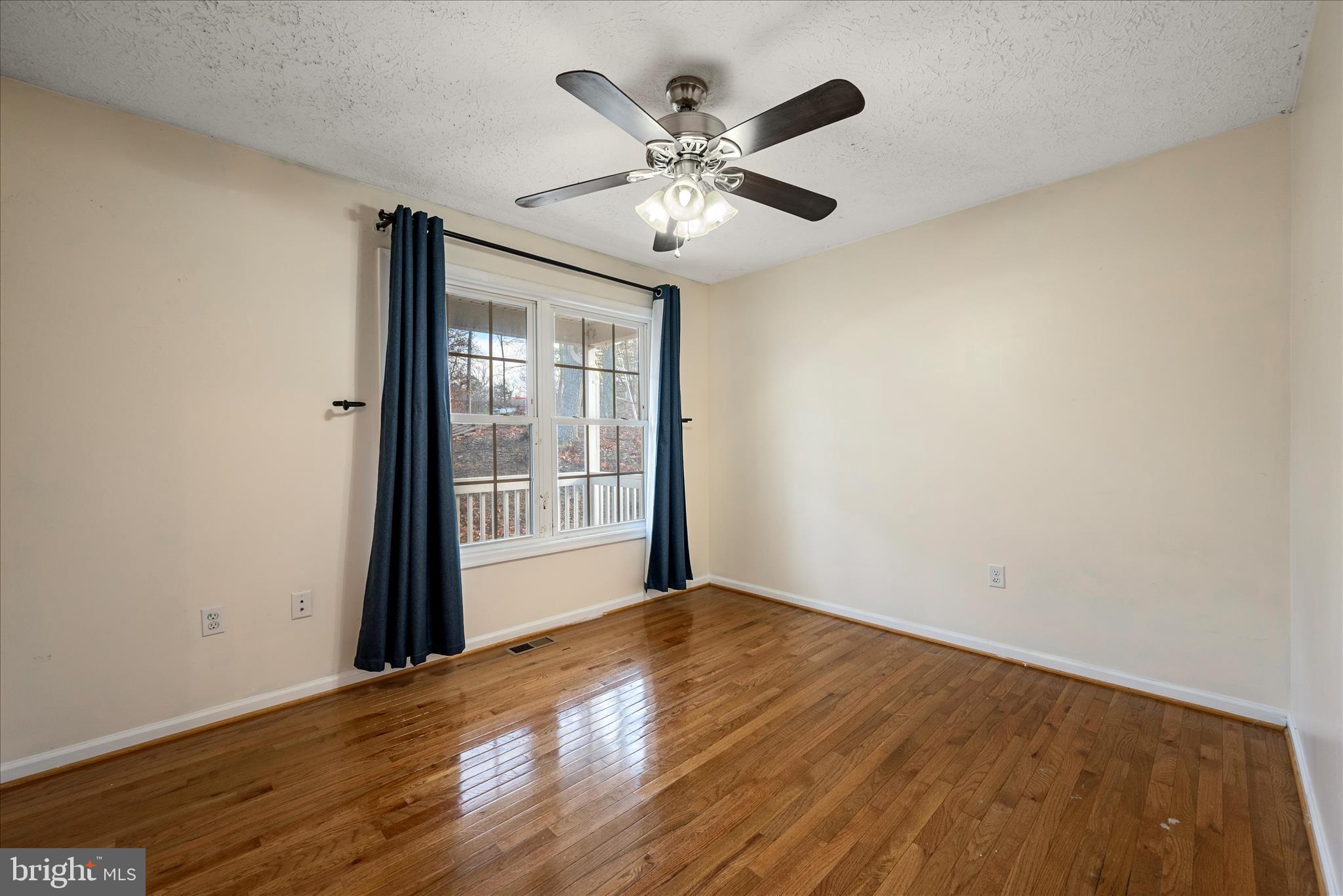 181 Brook View Road Front Royal, VA 22630 - Photo 15 of 47 a view of an empty room with wooden floor and a window