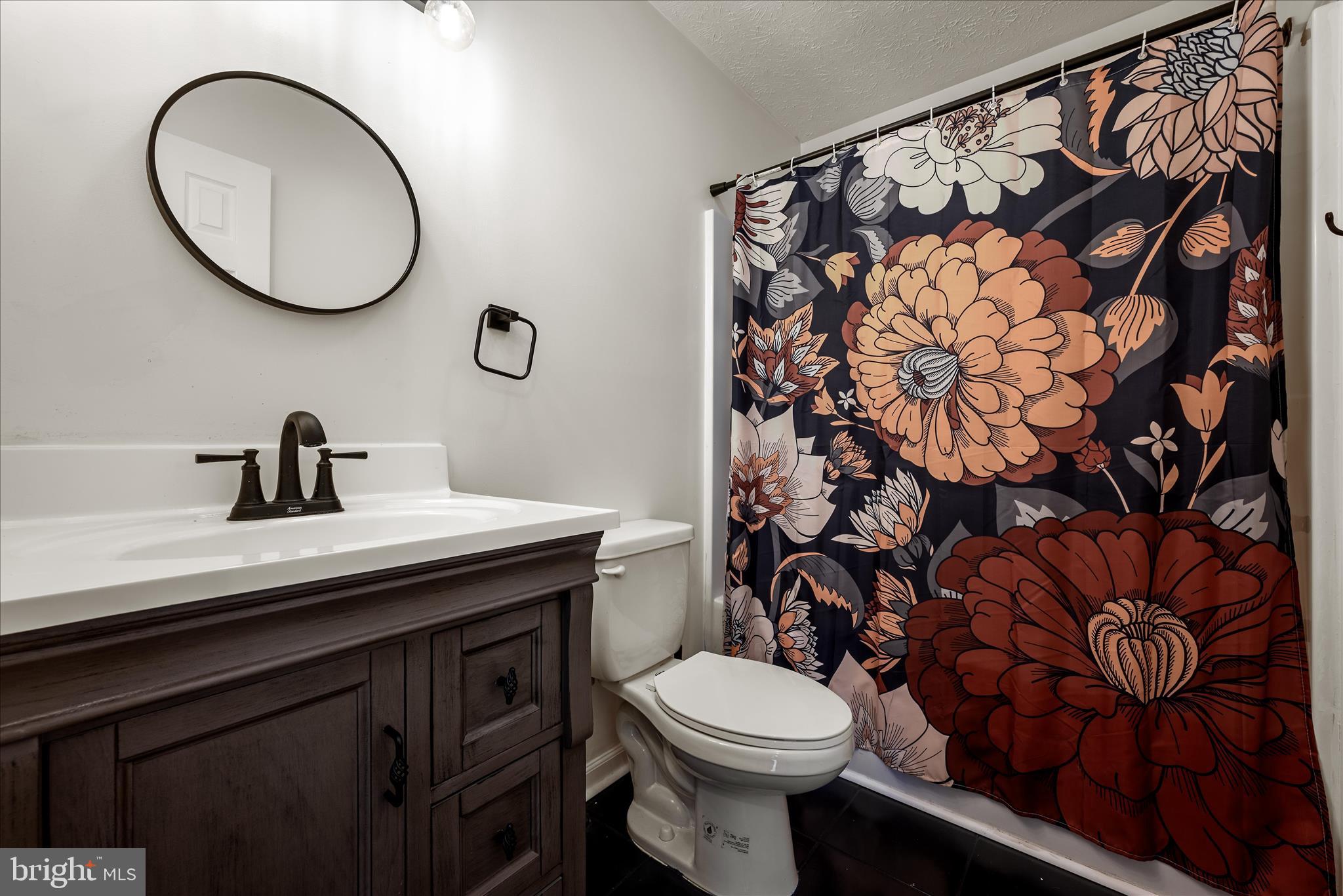 181 Brook View Road Front Royal, VA 22630 - Photo 17 of 47 a bathroom with a toilet a sink and a mirror