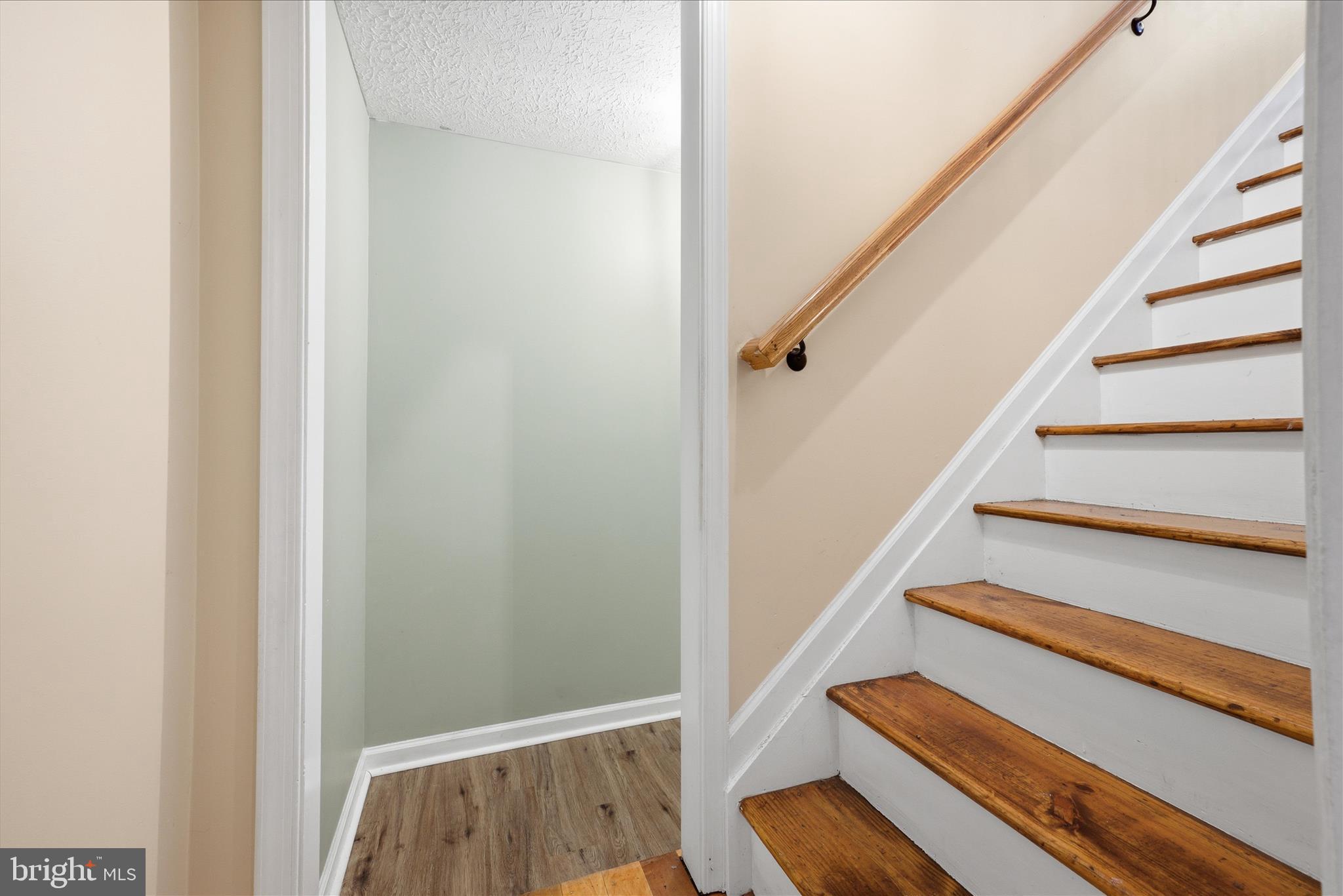 181 Brook View Road Front Royal, VA 22630 - Photo 19 of 47 a view of staircase with wooden floor and white walls