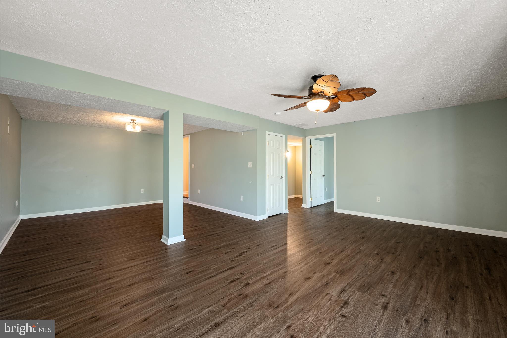 181 Brook View Road Front Royal, VA 22630 - Photo 21 of 47 a view of an empty room with wooden floor and a window