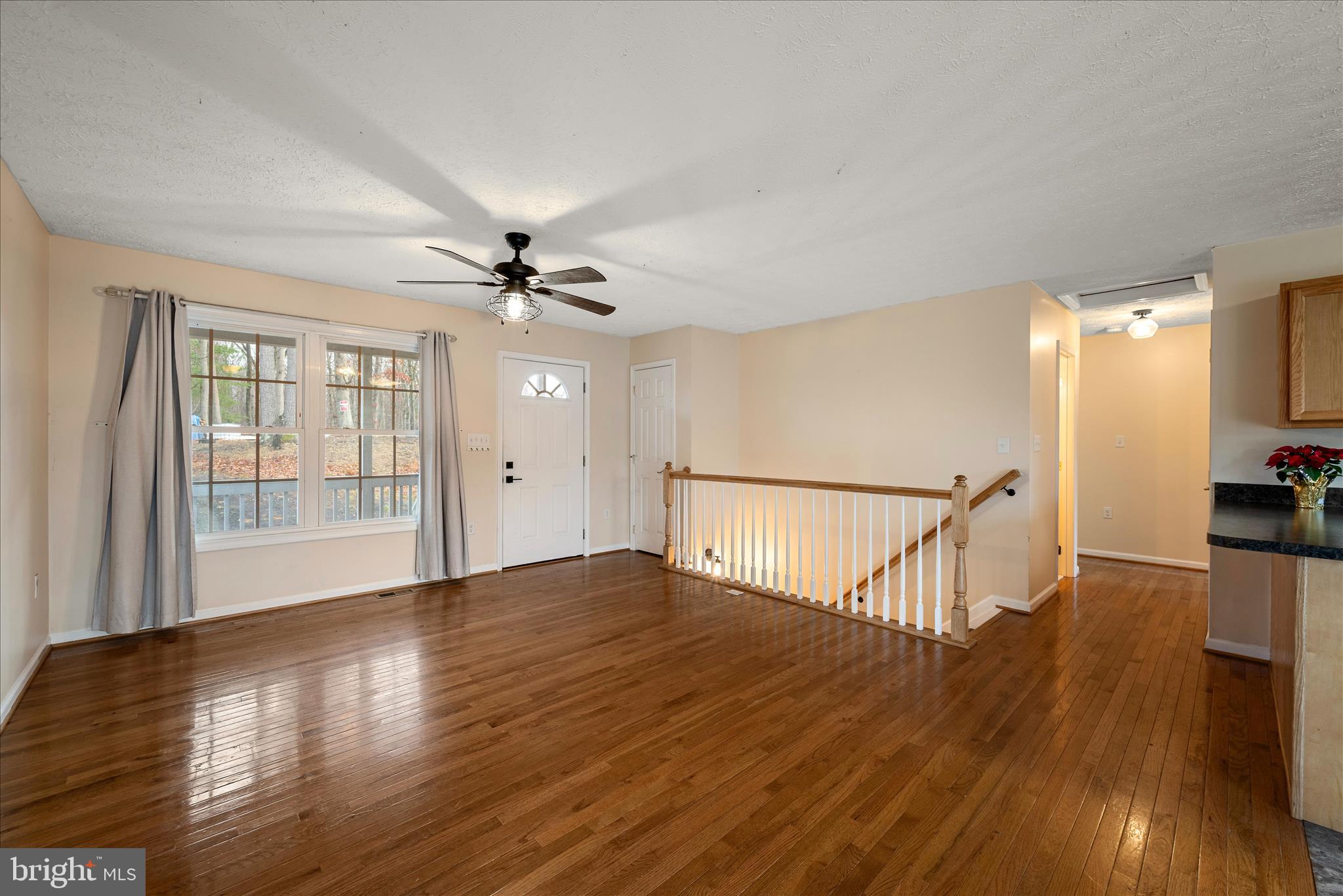 181 Brook View Road Front Royal, VA 22630 - Photo 6 of 47 a view of an empty room with wooden floor and a window