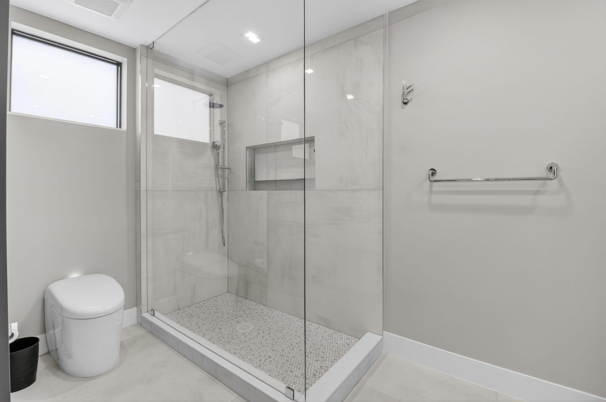 19221 Sabal Lake Drive, Unit 5124 Boca Raton, FL 33434 - Photo 31 of 98 a bathroom with a shower and a toilet