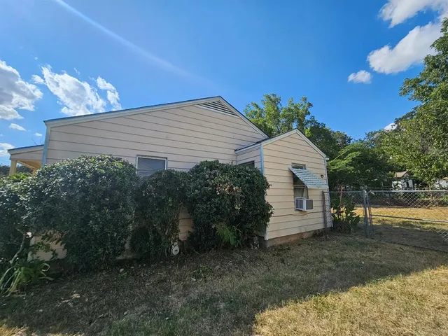 a house view with a backyard space