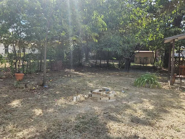 a backyard of a house with lots of green space