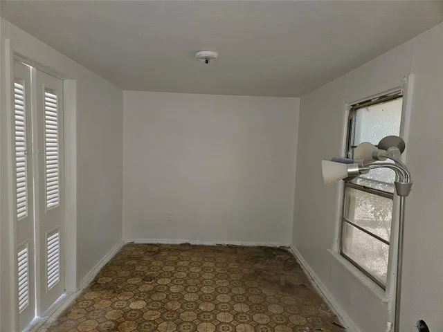 a view of empty room with windows