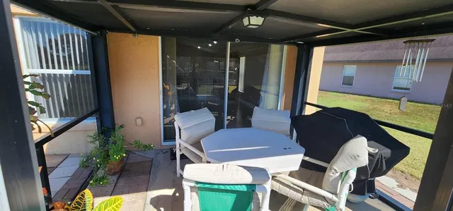 a backyard of a house with seating space