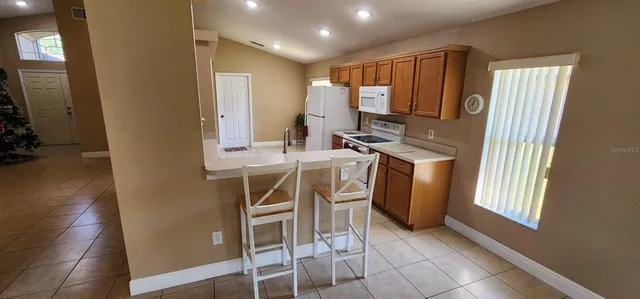 a view of a kitchen with a sink