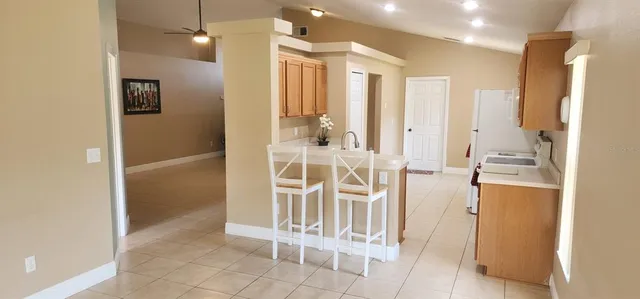 a kitchen with a stove and a refrigerator