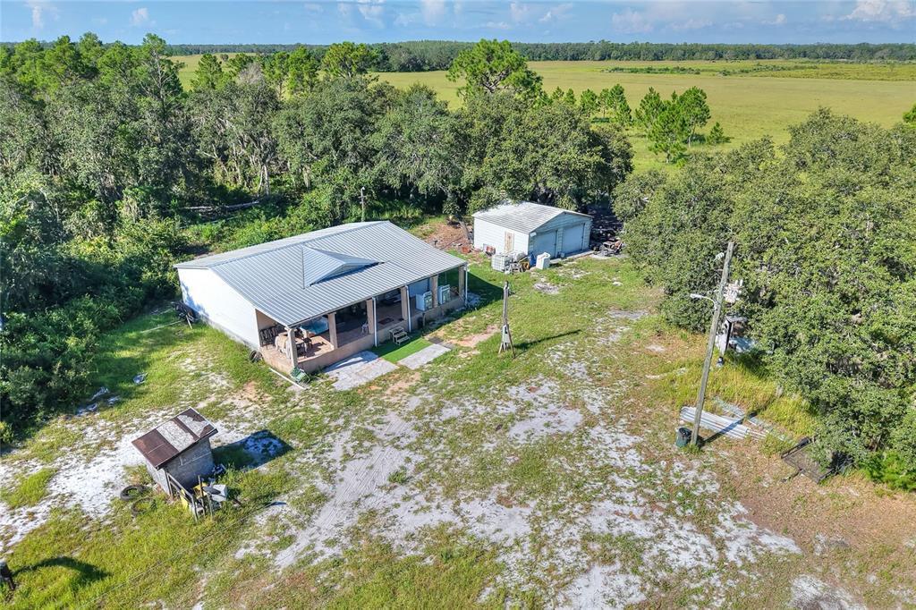 730 McClellan Road Frostproof, FL 33843 - Photo 1 of 50 a view of a house with a yard and lake view