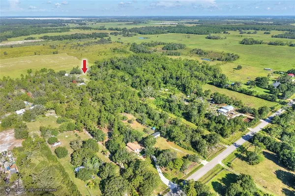 a view of a field with an ocean