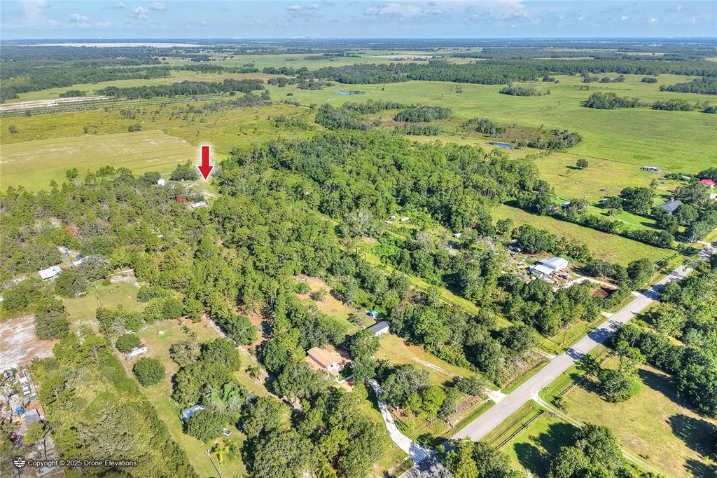 730 McClellan Road Frostproof, FL 33843 - Photo 7 of 50 a view of a field with an ocean