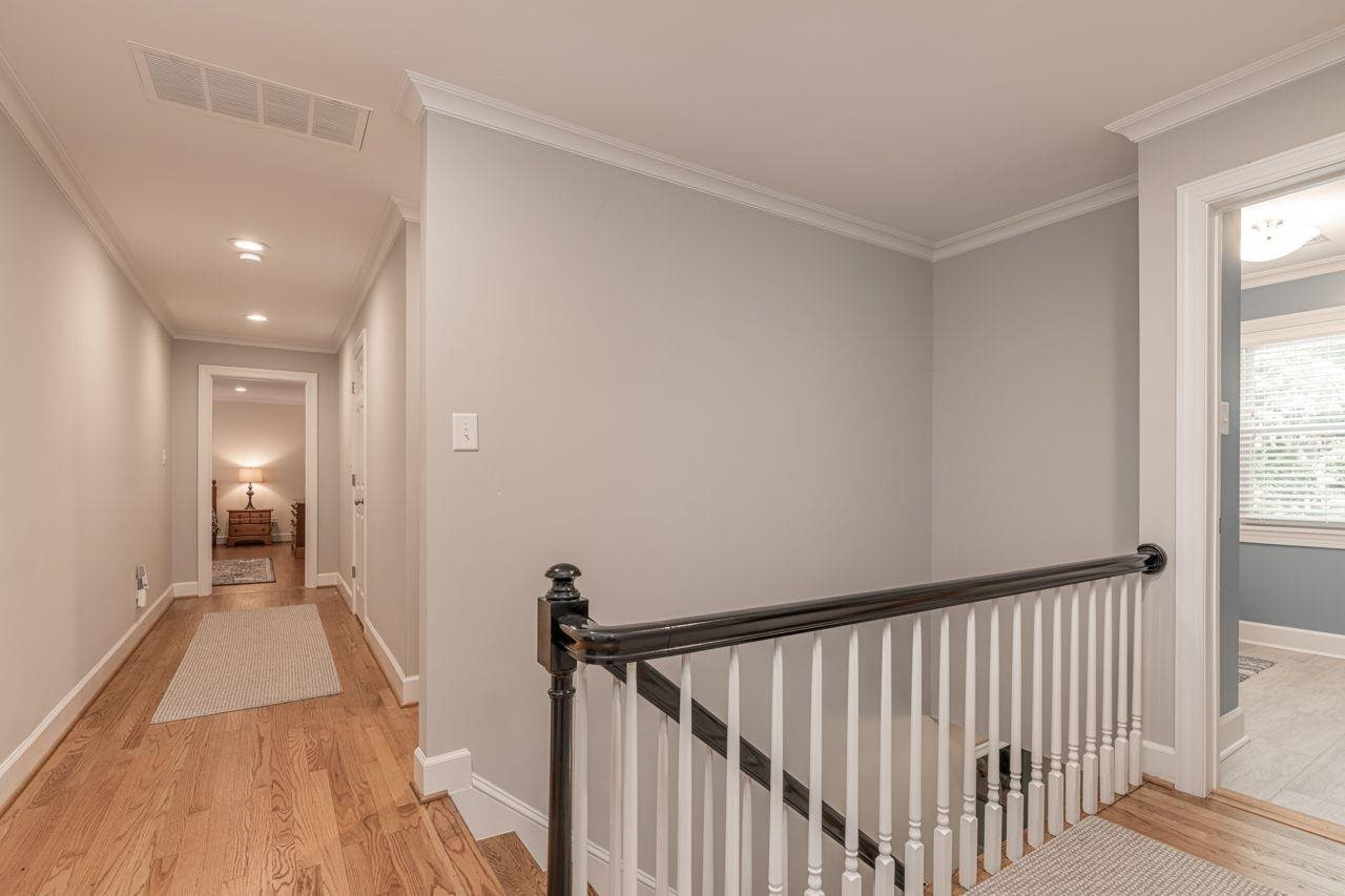4200 Oak Park Road Raleigh, NC 27612 - Photo 28 of 30 There is an incredible Storage Closet accessible from this Hallway! Wide Upstairs Hallway with abundant Lighting