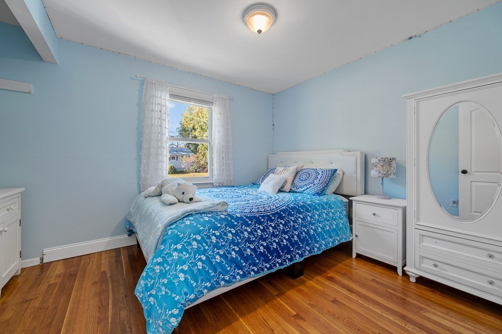 104 Conrad Road Marlborough, MA 01752 - Photo 14 of 34 a bedroom with a bed and a dresser